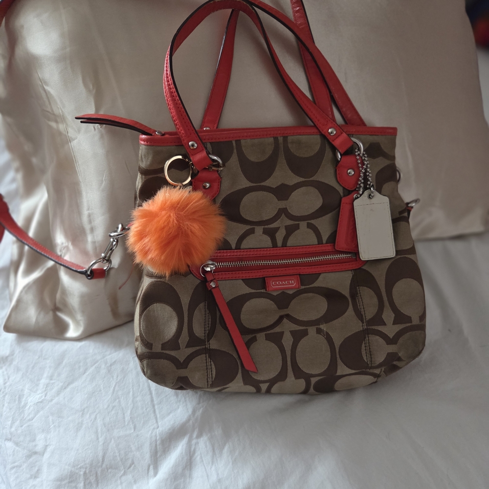Coach Brown Signature Canvas Shoulder Bag with Red Trim and Orange Pom Charm